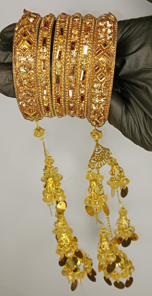 Bridal Golden Bangles Set With Intricate Stonework And Traditional Hanging Kaleere